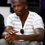 New England Patriot Chad Ochocinco Catches a Basketball Game